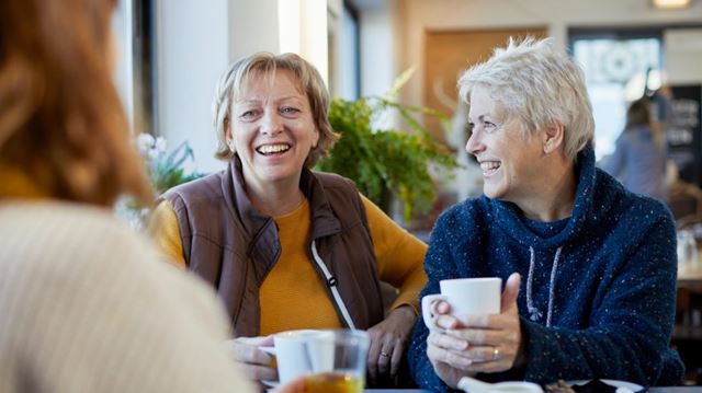 Friends meeting in cafe